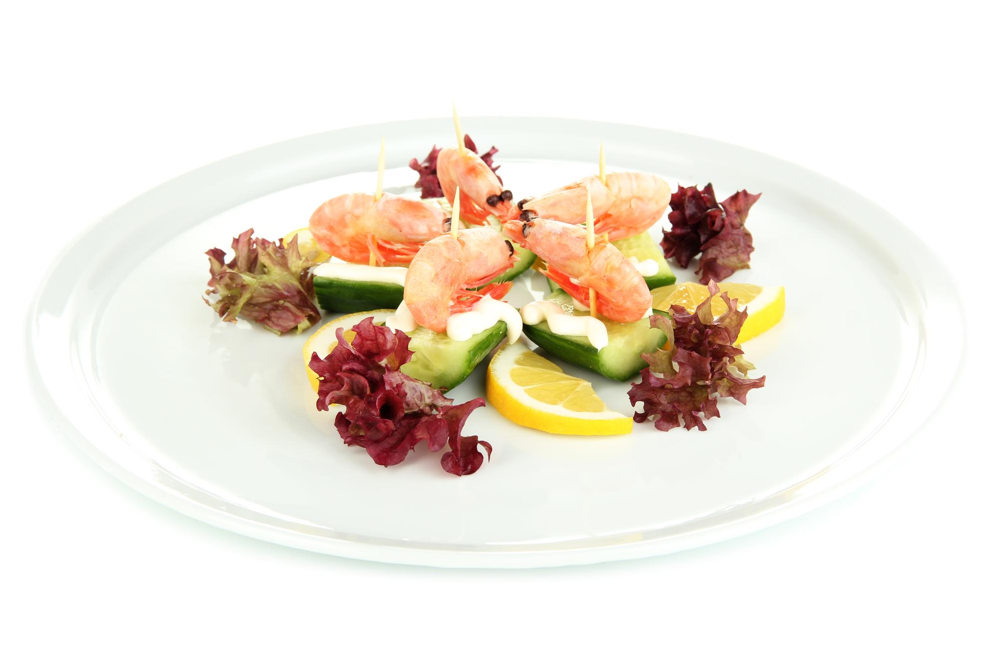 Plated seafood main course with herbs